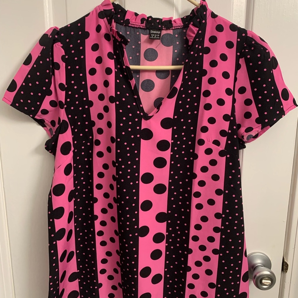 Black and pink polka dot shirt sleeve top.  Size M